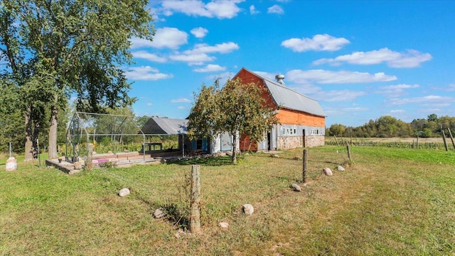 19334 105th Ave, Hayland Twp, MN 56353 - view of grassy yard featuring a barn and an outbuilding