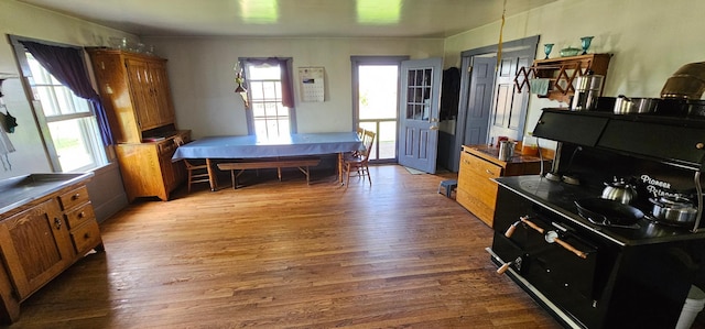 33580 156th St, Harmony Twp, MN 55939 - kitchen with brown cabinetry and wood finished floors