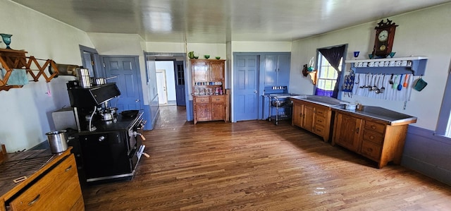33580 156th St, Harmony Twp, MN 55939 - kitchen featuring dark wood-type flooring, brown cabinets, and a desk