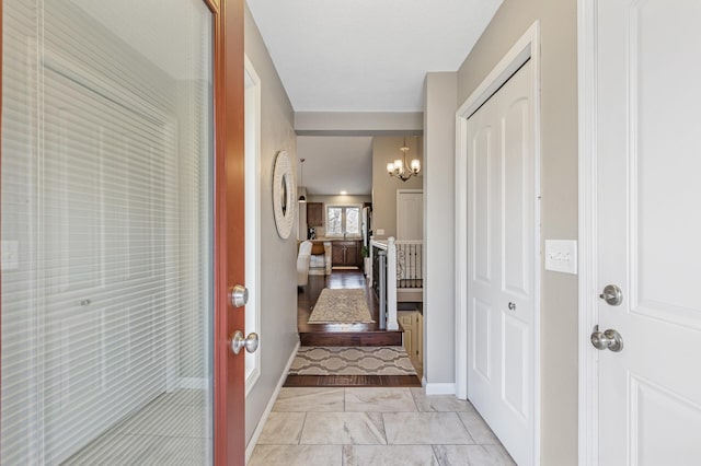 3664 Canary Way, Eagan, MN 55123 - foyer entrance with a chandelier, light marble finish floors, and baseboards