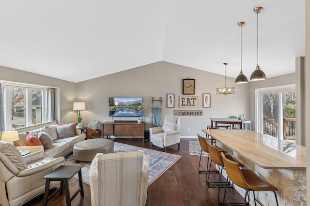 3664 Canary Way, Eagan, MN 55123 - living room with vaulted ceiling, dark wood finished floors, baseboards, and a chandelier