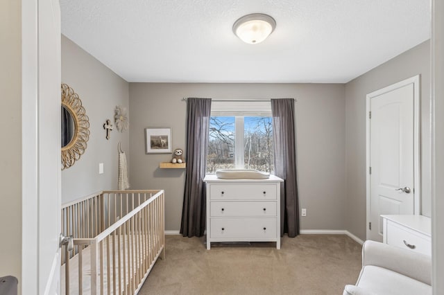 3664 Canary Way, Eagan, MN 55123 - bedroom with light carpet, baseboards, a crib, and a textured ceiling
