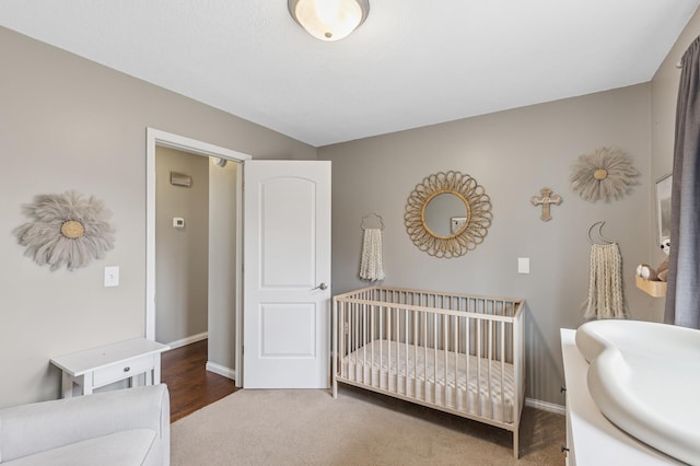 3664 Canary Way, Eagan, MN 55123 - carpeted bedroom featuring a sink, baseboards, and a nursery area