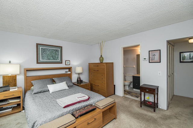 207 5th Ave SW Unit 208, Rochester, MN 55902 - carpeted bedroom featuring a closet, connected bathroom, and a textured ceiling