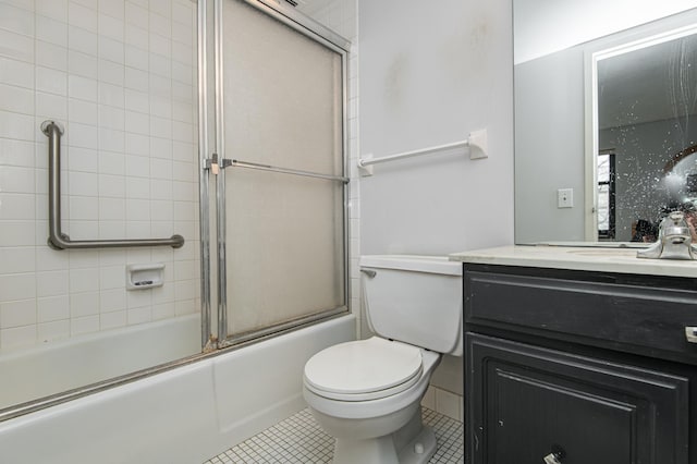 207 5th Ave SW Unit 208, Rochester, MN 55902 - full bathroom featuring vanity, toilet, tile patterned flooring, and enclosed tub / shower combo