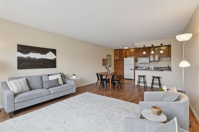 1912 Dupont Ave S Unit 302, Minneapolis, MN 55403 - living area with dark wood-style floors and baseboards