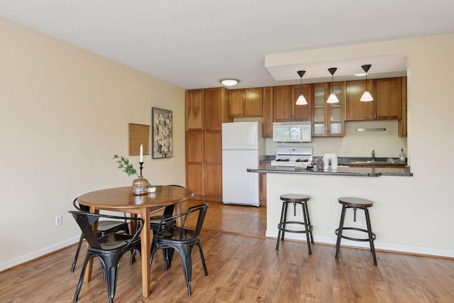 1912 Dupont Ave S Unit 302, Minneapolis, MN 55403 - dining space featuring wood finished floors and baseboards