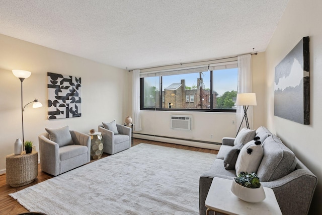 1912 Dupont Ave S Unit 302, Minneapolis, MN 55403 - living room featuring a baseboard radiator, wood finished floors, a wall unit AC, and a textured ceiling