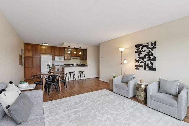 1912 Dupont Ave S Unit 302, Minneapolis, MN 55403 - living area featuring wood finished floors and baseboards