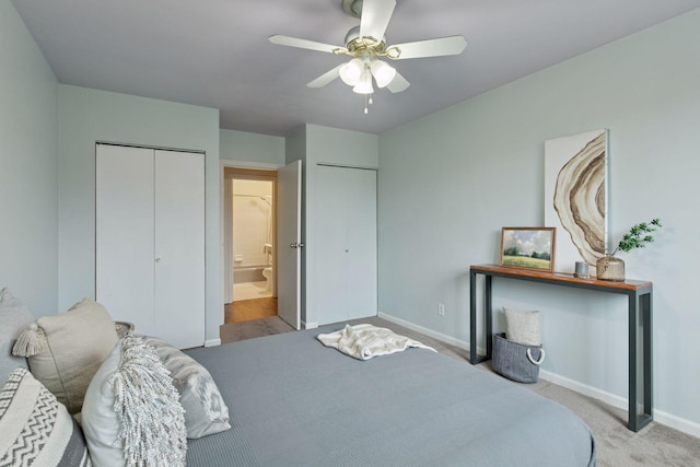 1912 Dupont Ave S Unit 302, Minneapolis, MN 55403 - carpeted bedroom featuring baseboards, two closets, and a ceiling fan