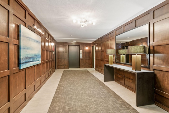 1912 Dupont Ave S Unit 302, Minneapolis, MN 55403 - hall featuring elevator, a chandelier, wooden walls, and a desk