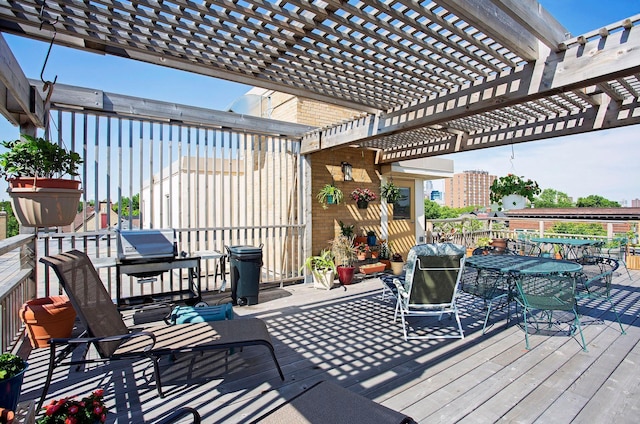 1912 Dupont Ave S Unit 302, Minneapolis, MN 55403 - wooden deck featuring a pergola and outdoor dining space