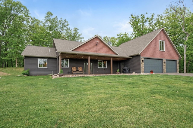 7410 313th Ave NE, North Branch Twp, MN 55056 - craftsman-style home with a front lawn, asphalt driveway, a shingled roof, and an attached garage