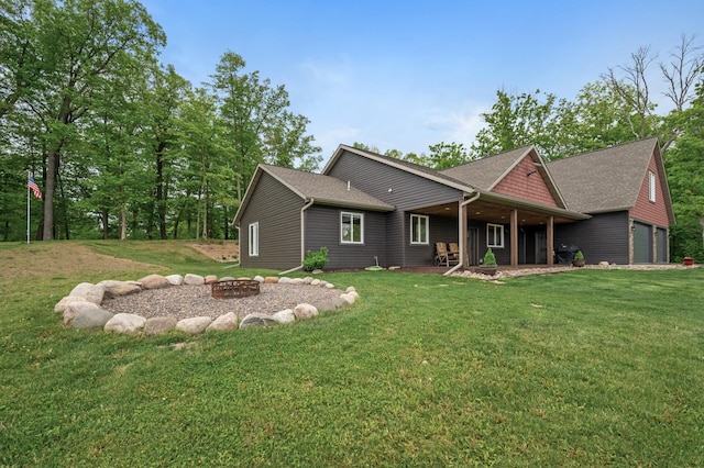 7410 313th Ave NE, North Branch Twp, MN 55056 - rear view of house with a fire pit, a yard, and a shingled roof
