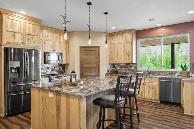 7410 313th Ave NE, North Branch Twp, MN 55056 - kitchen with appliances with stainless steel finishes, light brown cabinets, dark wood-style floors, decorative backsplash, and recessed lighting