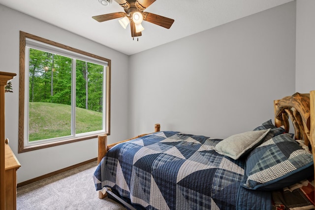 7410 313th Ave NE, North Branch Twp, MN 55056 - carpeted bedroom featuring baseboards and a ceiling fan