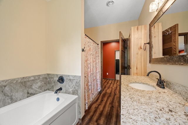 7410 313th Ave NE, North Branch Twp, MN 55056 - bathroom with vanity, a garden tub, and wood finished floors