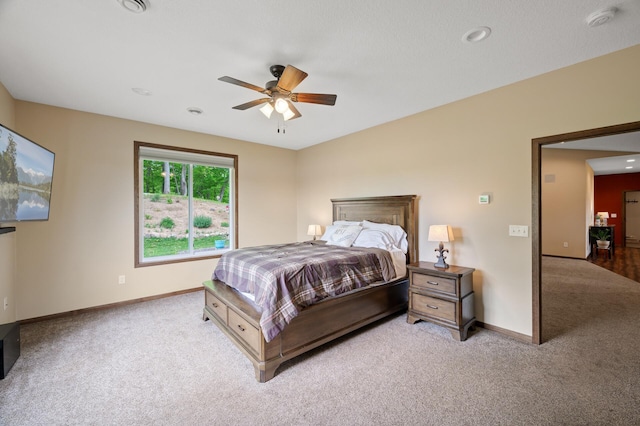 7410 313th Ave NE, North Branch Twp, MN 55056 - bedroom with light colored carpet, baseboards, and a ceiling fan