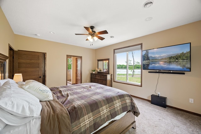 7410 313th Ave NE, North Branch Twp, MN 55056 - carpeted bedroom with baseboards and a ceiling fan