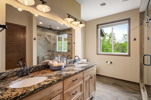 7410 313th Ave NE, North Branch Twp, MN 55056 - full bathroom with healthy amount of natural light, a shower stall, and double vanity