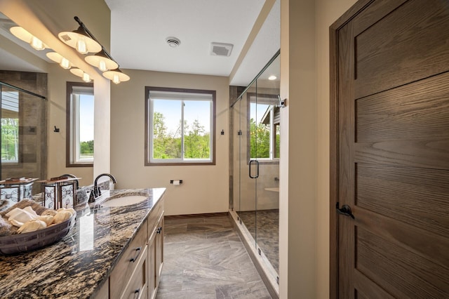 7410 313th Ave NE, North Branch Twp, MN 55056 - bathroom featuring vanity, a shower stall, and marble finish flooring