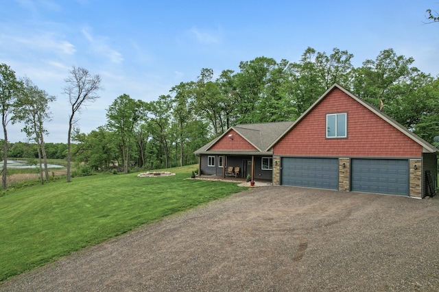 7410 313th Ave NE, North Branch Twp, MN 55056 - view of front facade with a front yard, driveway, a garage, a water view, and a porch