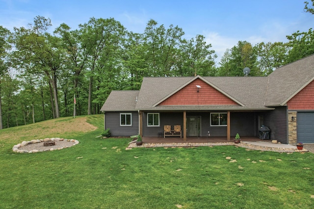 7410 313th Ave NE, North Branch Twp, MN 55056 - view of front of home featuring an outdoor fire pit, a front yard, an attached garage, and a shingled roof