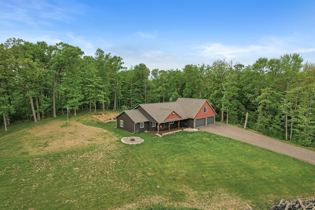 7410 313th Ave NE, North Branch Twp, MN 55056 - view of front facade with dirt driveway, a front lawn, and a forest view