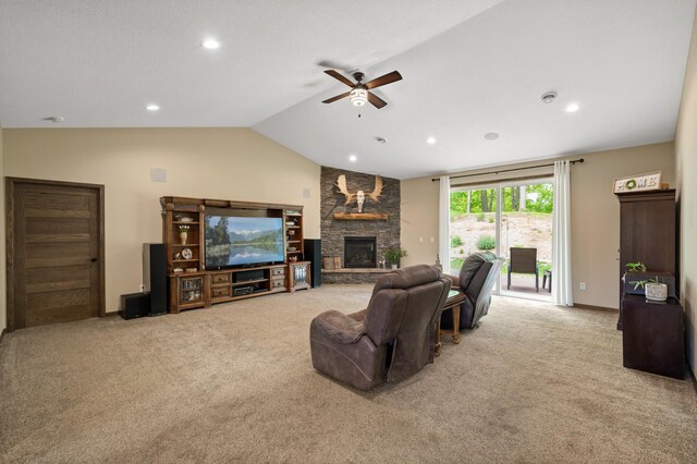 7410 313th Ave NE, North Branch Twp, MN 55056 - carpeted living room featuring a ceiling fan, lofted ceiling, a stone fireplace, recessed lighting, and baseboards