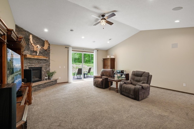 7410 313th Ave NE, North Branch Twp, MN 55056 - living area with a ceiling fan, lofted ceiling, carpet floors, a stone fireplace, and baseboards