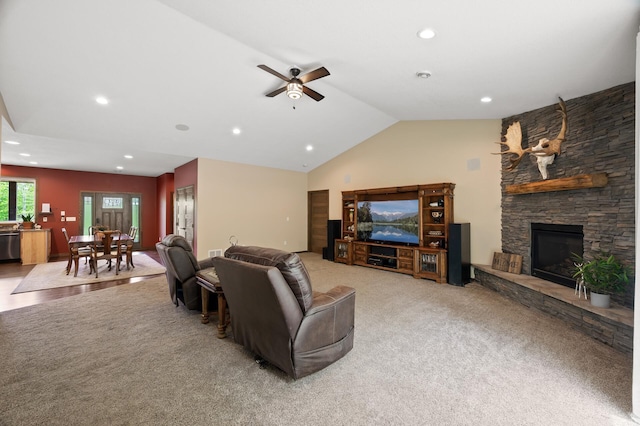 7410 313th Ave NE, North Branch Twp, MN 55056 - living area featuring light colored carpet, vaulted ceiling, recessed lighting, a ceiling fan, and a fireplace