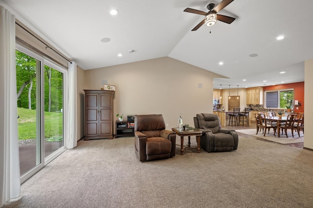 7410 313th Ave NE, North Branch Twp, MN 55056 - living area featuring light carpet, plenty of natural light, a ceiling fan, lofted ceiling, and recessed lighting
