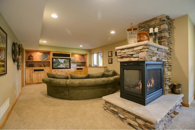 5177 Muir Ave N, Baytown Twp, MN 55082 - living room with light colored carpet, a stone fireplace, baseboards, and recessed lighting