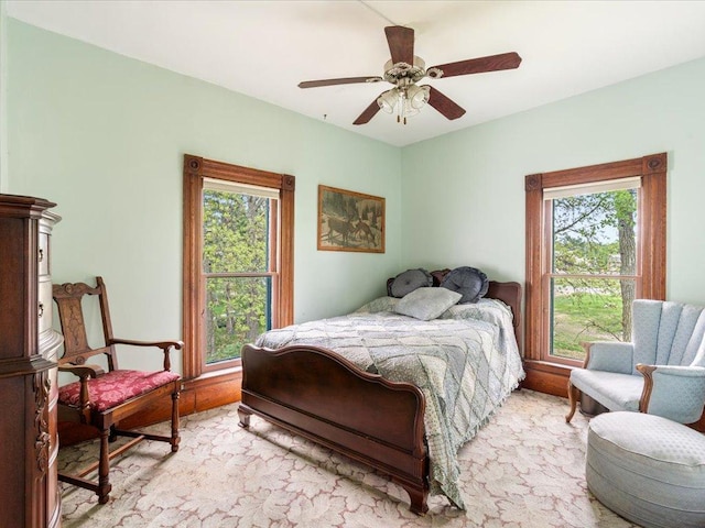 114 Washburn Ave W, Backus, MN 56435 - bedroom featuring multiple windows and ceiling fan