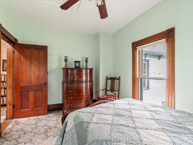 114 Washburn Ave W, Backus, MN 56435 - bedroom featuring ceiling fan and baseboards