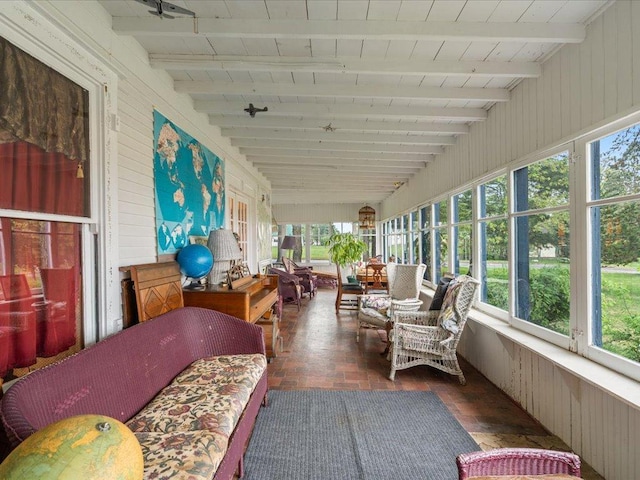 114 Washburn Ave W, Backus, MN 56435 - sunroom with wood walls, healthy amount of natural light, and wood ceiling with exposed beams