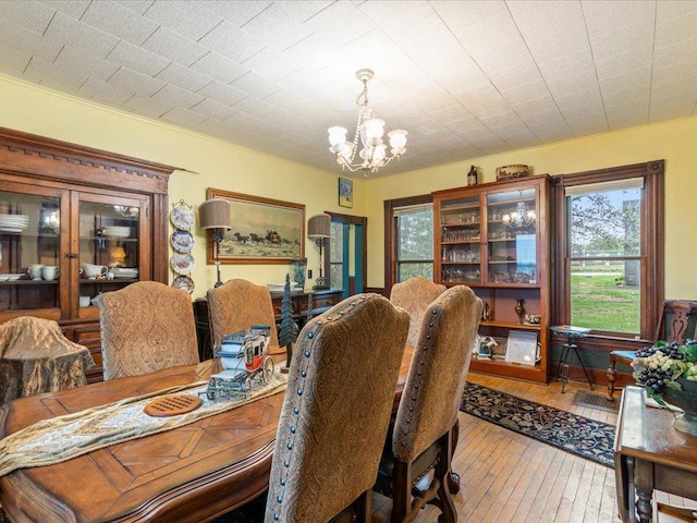 114 Washburn Ave W, Backus, MN 56435 - dining area with a chandelier and hardwood / wood-style flooring
