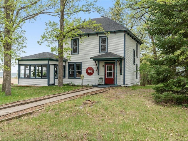 114 Washburn Ave W, Backus, MN 56435 - view of front of house featuring a front lawn and roof with shingles