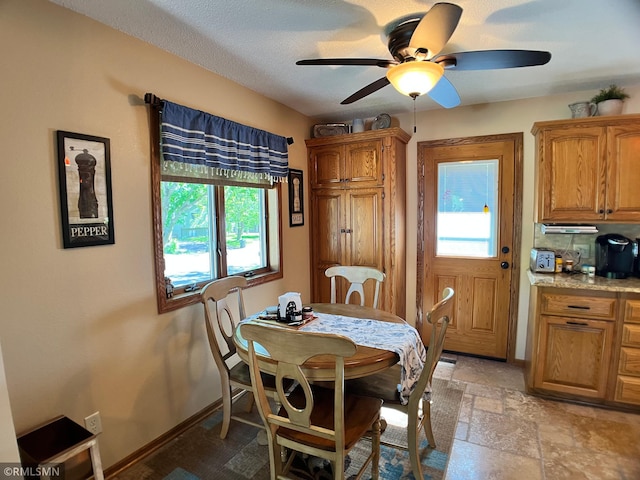 204 10th St N, Sartell, MN 56377 - dining area with ceiling fan and baseboards
