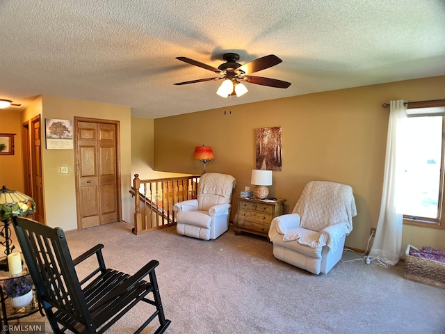204 10th St N, Sartell, MN 56377 - bedroom featuring light carpet, a textured ceiling, ceiling fan, and two closets