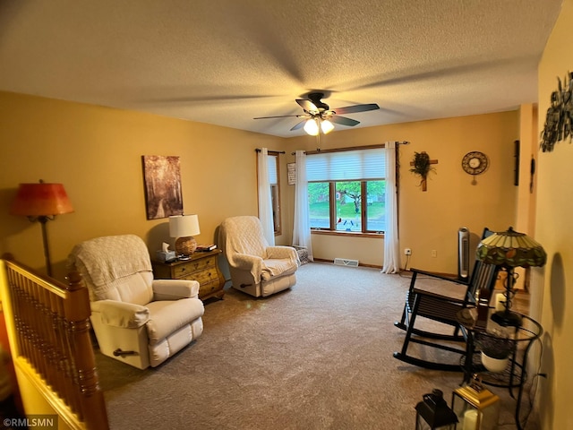 204 10th St N, Sartell, MN 56377 - living area featuring a ceiling fan, carpet floors, and a textured ceiling