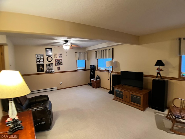 204 10th St N, Sartell, MN 56377 - living area featuring ceiling fan, carpet flooring, a baseboard radiator, and baseboards