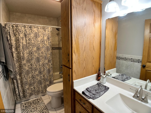 204 10th St N, Sartell, MN 56377 - full bath featuring vanity, toilet, tile walls, shower / bath combo with shower curtain, and tile patterned flooring