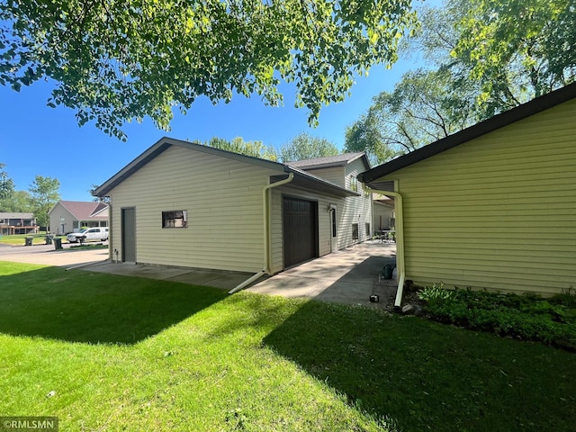 204 10th St N, Sartell, MN 56377 - view of home's exterior with a yard, a garage, and a patio area