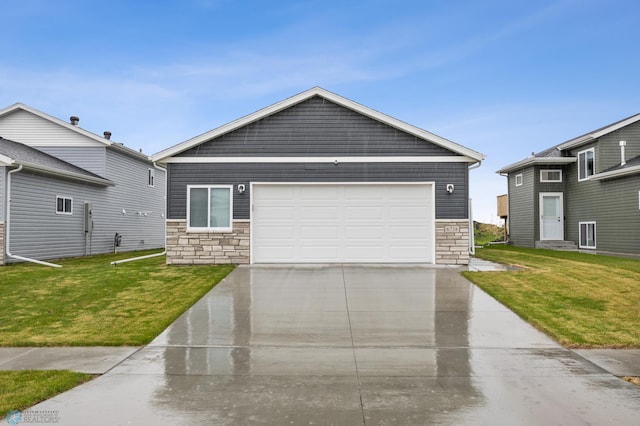 6738 Joseph St, Horace, ND 58047 - view of front of home with stone siding, driveway, a front yard, and an attached garage