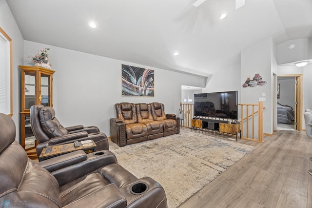 6738 Joseph St, Horace, ND 58047 - living area featuring wood finished floors, vaulted ceiling, and recessed lighting