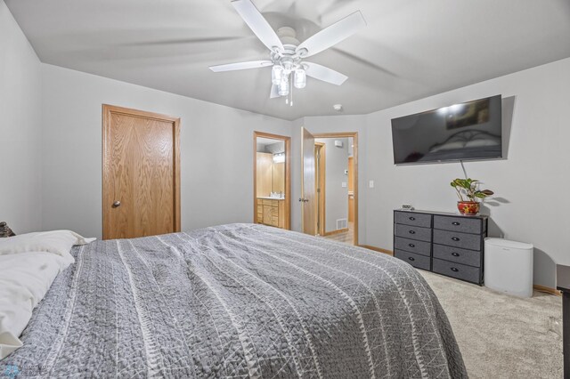 6738 Joseph St, Horace, ND 58047 - bedroom with carpet flooring, ceiling fan, connected bathroom, and baseboards
