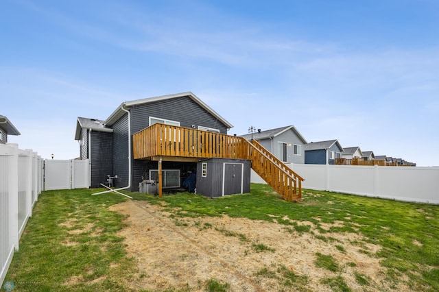 6738 Joseph St, Horace, ND 58047 - rear view of property featuring a wooden deck, stairs, and a gate