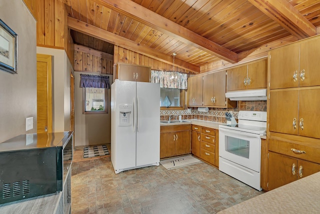 148 21st Ave N, Saint Cloud, MN 56303 - kitchen featuring white appliances, under cabinet range hood, stone finish floors, wooden ceiling, and brown cabinetry