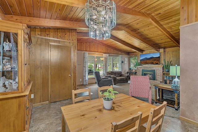 148 21st Ave N, Saint Cloud, MN 56303 - dining room with stone tile flooring, a fireplace, baseboards, a chandelier, and wooden ceiling